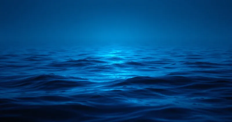 Cool blue dawn light over still open water (illustration)