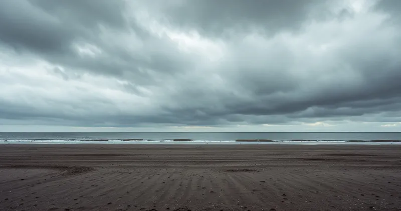 Heavy grey clouds over a quiet empty shoreline (illustration)