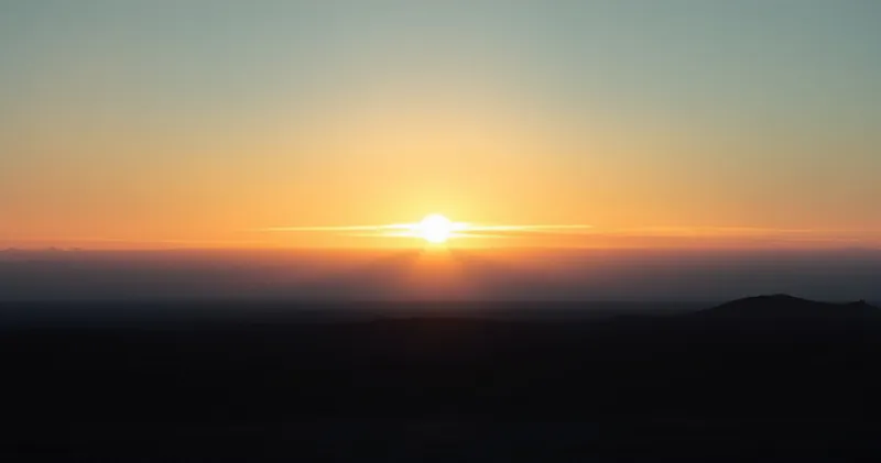 Sunrise light spilling over a quiet horizon (illustration)