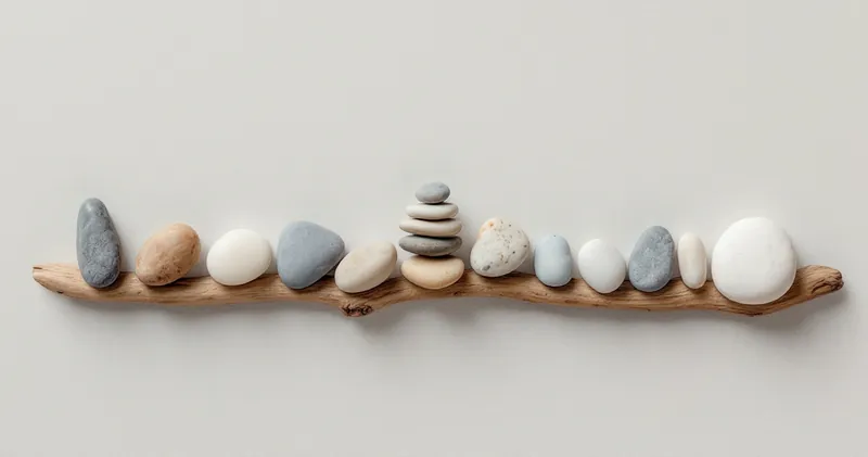 Smooth pebbles arranged in a row on pale driftwood (illustration)