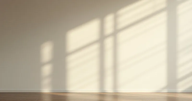 Soft prism light spread across a plain pale wall (illustration)