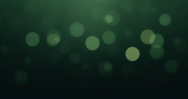 Muted green abstract bokeh on a dark background (illustration)