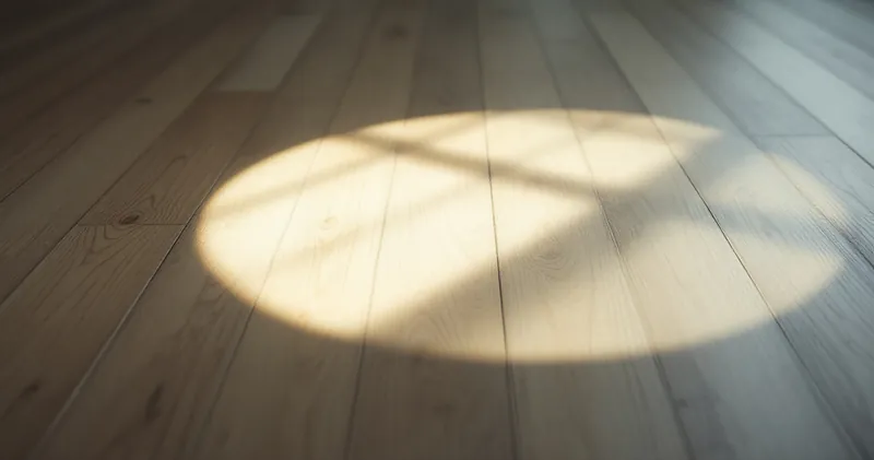 Circle of soft light on a plain wooden floor (illustration)