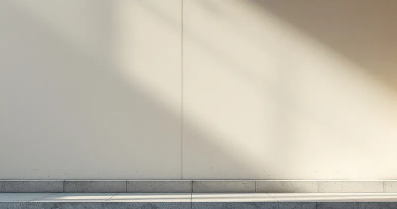 Plain wall with a single soft beam of light breaking across it (illustration)