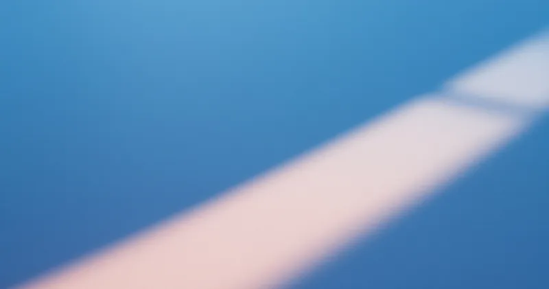 Soft blue light across a plain desk surface at dusk (illustration)