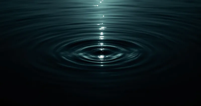 Deep still water with a single shaft of light reaching down (illustration)