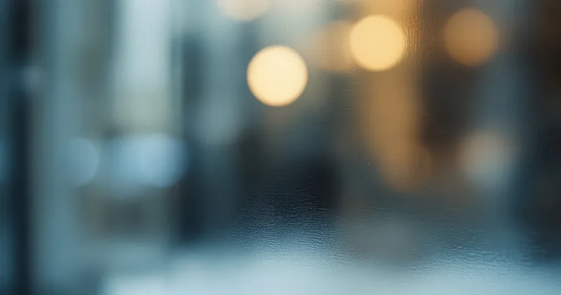 Abstract soft blue and grey light refracted through textured glass (illustration)