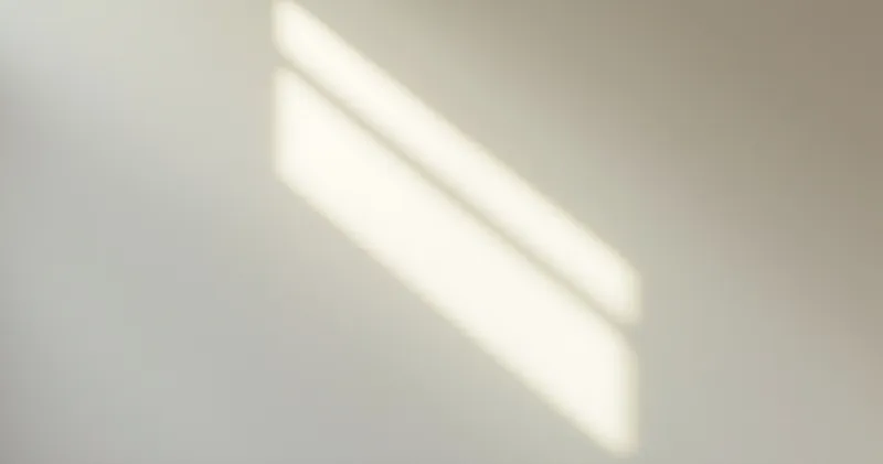 Two soft parallel beams of light across a pale wall (illustration)