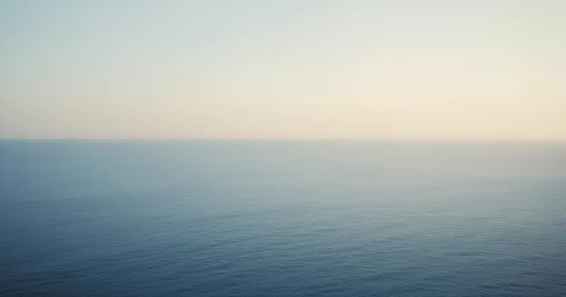 A calm horizon where sea meets sky in a soft gradient (illustration)