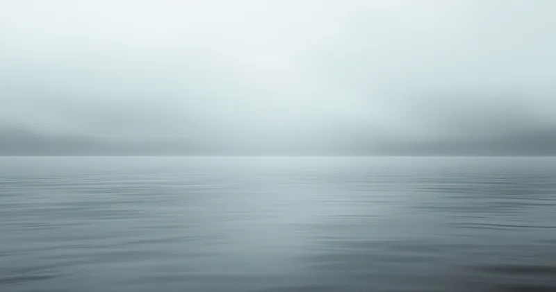 A muted grey horizon over still water (illustration)