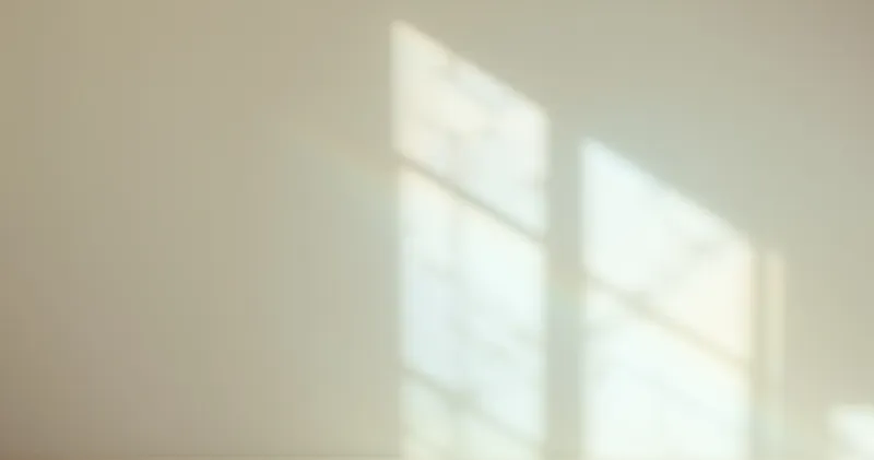 Soft prism light spread across a pale wall (illustration)