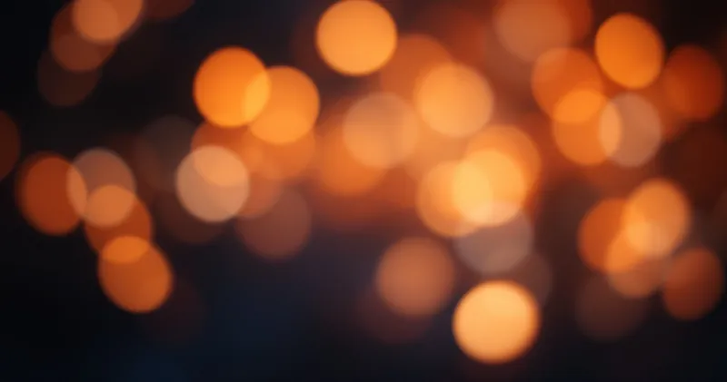 Warm multicoloured bokeh on a dark calm background (illustration)